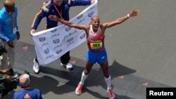 Meb Keflezighi of the United States celebrates after winning the 2014 Boston Marathon, April 21, 2014. (Credit: Greg M. Cooper-USA TODAY Sports)