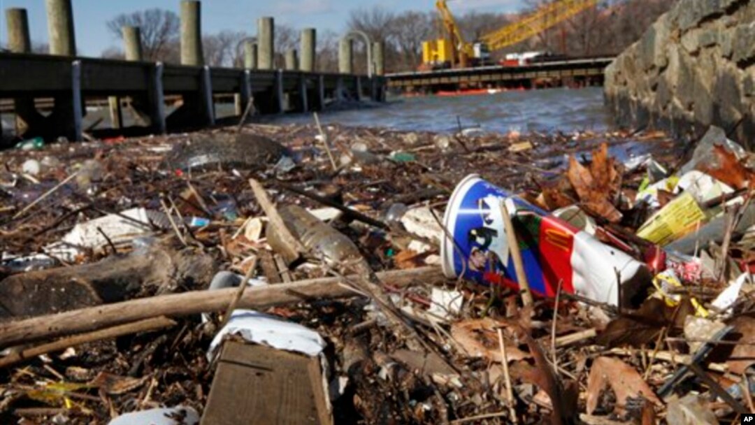 FILE - In this file photo from Feb. 12, 2009, trash piles up on the Anacostia River in Washington. District of Columbia city council will vote Tuesday June 2, 2009, on legislation on proposed fees for plastic and paper shopping bags to help reduce the amo