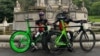 FILE - Ugandan cyclists Paul Lomuria and Lawrence Lorot pose for a photograph during the 2023 UCI Cycling World Championships in Glasgow, Scotland, Britain, August 7, 2023.