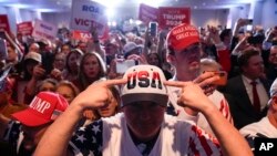 FILE—Supporters cheer as Republican presidential candidate former President Donald Trump speaks at a primary election night party at the South Carolina State Fairgrounds in Columbia, S.C., February 24, 2024.