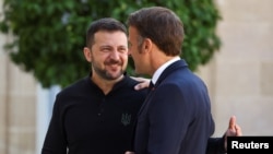 FILE - Ukraine President Volodymyr Zelenskyy, left, meets with French President Emmanuel Macron at the Elysee Palace in Paris, June 7, 2024. The two leaders will meet again in Paris on Thursday.