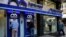 FILE - People use an ATM outside a bank, in Beirut, Lebanon, Nov. 20, 2019. 