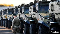 FILE - British troops arrive to Hoek van Holland to travel by land to Norway, as part of the NATO's military exercise, in Hoek van Holland, Netherlands, Oct. 10, 2018. Four U.S. soldiers were injured while delivering cargo for the exercise.