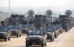 Military vehicles are seen on display in a parade on Armed Forces Day, in Naypyitaw, Myanmar, March 27, 2021.
