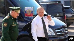Rusya Savunma Bakani Sergey Şoygu ve Rusya lideri Vladimir Putin
