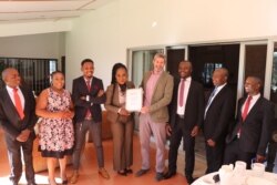 David Beer, center, British high commissioner in Malawi, is pictured with members of Malawi’s COVID Response Private Citizens Initiative. (British High Commission)