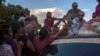 BRAZIL – Venezuelan refugees try to receive clothes distributed by volunteers at the Simon Bolivar square in the city of Boa Vista, Roraima, Brazil, on February 25, 2018.