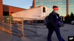 Nurse Jessica Franz leaves the Olathe Medical Center after working the graveyard shift Thanksgiving Day Nov 26, 2020 that she is celebrating without her mother-in-law, Elaine Franz, who died of the coronavirus on Nov. 10, a day before her 78th birthday.