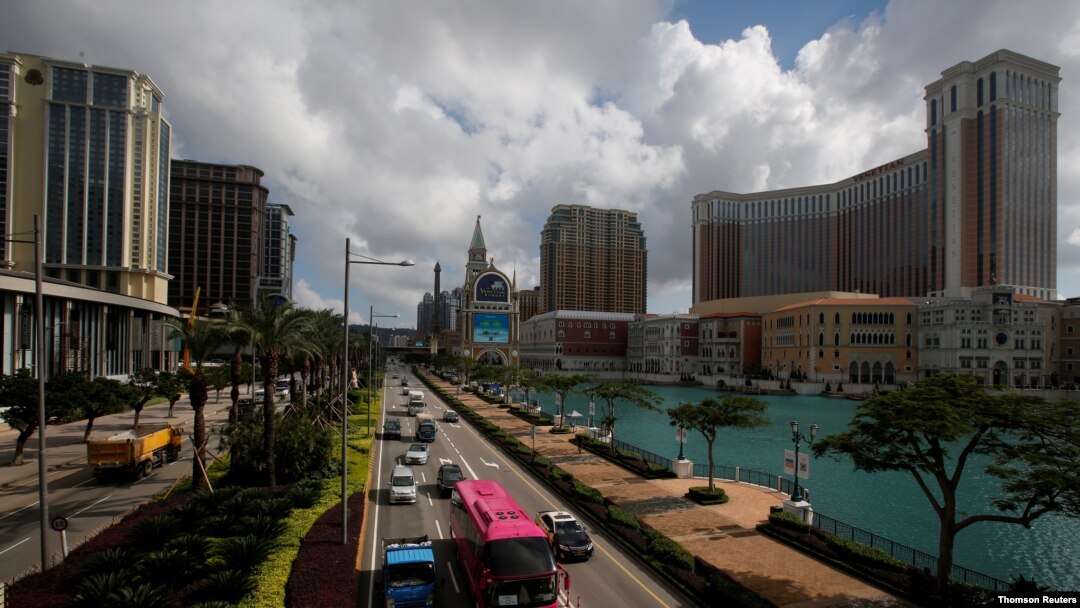 FILE - Traffic flows past gaming resorts at Cotai Strip in Macau, May 15, 2018. 