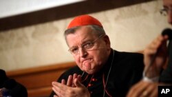 Cardinal Raymond Burke applauds during a press conference on the first anniversary of the death of Cardinal Carlo Caffarra, at the Italian Senate, Sept. 6, 2018. 