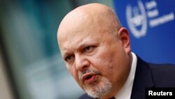 FILE - International Criminal Court prosecutor Karim Khan speaks about the violence in Israel and the occupied Palestinian territories, in The Hague, Netherlands, on Oct. 12, 2023. Khan visited Israel, the ICC said on Nov. 30, and plans to go to the West Bank.