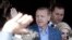 Turkey's Prime Minister Regep Tayyip Erdogan acknowledges supporters outside a polling station in Istanbul March 30, 2014.
