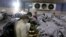 People identify the body of a relative, who was killed in Friday's plane crash, at a morgue in Karachi, Pakistan, May 23, 2020. 
