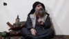 The chief of the Islamic State group, Abu Bakr al-Baghdadi, purportedly appears for the first time in five years in a propaganda video in an undisclosed location, in this undated TV grab taken from video released April 29 by Al-Furqan media. 