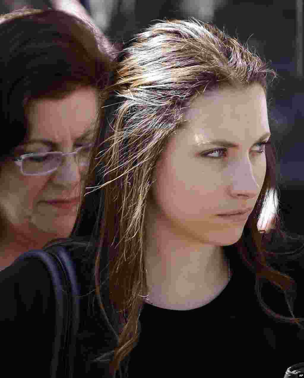 Aimee Pistorius, sister of Oscar Pistorius, leaves the high court in Pretoria, South Africa, Oct. 16, 2014. 