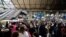 Passengers queue at the departure gates of the Eurostar terminal at Gare du Nord train station in Paris on Dec. 30, 2023, as flooding in a railway tunnel near London forced the cancellation of more than a dozen trains linking Britain with the European mainland.