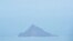 A handout photo taken on Jan. 18, 2022, and released Jan. 21 by New Zealand Defence Public Affairs shows an aerial view of Hunga Tonga-Hunga Ha’apai volcano following the eruption from the undersea volcano Jan. 15. 