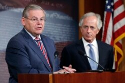 U.S. Senate Foreign Relations Committee Chairman Robert Menendez, left, and ranking member Senator Bob Corker are seen holding a news conference on Capitol Hill in Washington, D.C.