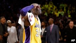 Los Angeles Lakers' Kobe Bryant solutes as he acknowledges fans after the last NBA basketball game of his career, against the Utah Jazz on Wednesday, April 13, 2016.