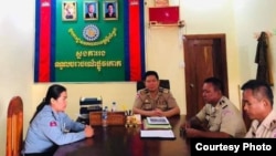 Deputy police chief Sithong Sokha meets with Stung Treng police officials after she posted a photo of herself breastfeeding her child while on the job. (Courtesy photo)