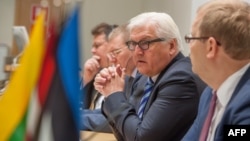 Estonian Foreign Minister Urmas Paet (R) listens to counterpart Frank-Walter Steinmeier from Germany (2dR), as they give a joint press conference with Linas Linkevicius from Lithuania (L) and Edgars Rinkevics from Latvia (2dL) following their meeting focu