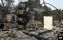 Damage to winemaking vats and barrels at the production house of Paradise Ridge Winery from a wildfire are seen, Oct. 10, 2017, in Santa Rosa, California.