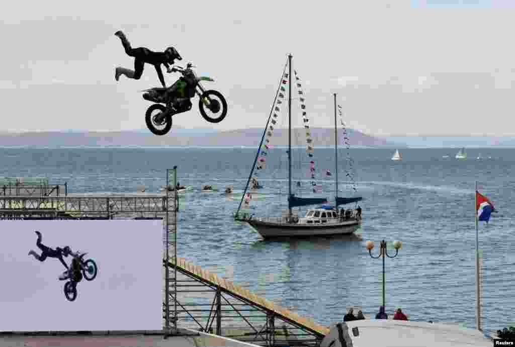 A participant performs during the motorbike and water sports festival &quot;Vladivostok-2020&quot; in Vladivostok, Russia.