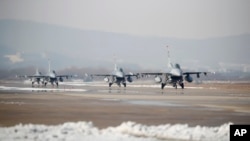 FILE - U.S. Air Force F-16 fighter jets take part in a joint aerial drills called Vigilant Ace between U.S and South Korea, at the Osan Air Base in Pyeongtaek, South Korea.