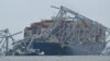 Міст Френсіса Скотта Кі у Балтиморі після того, як в його опору врізався контейнеровіз, 27 березня 2024. Photo by Jim WATSON/AFP