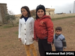 While so many children in Syria have had to flee, these children have been able to come back to their village. Credit: Mahmoud Bali.