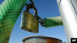 A padlock hangs outside the Tae Kwon Do and Handball stadium at the Faliro Coastal Zone, near Athens, August 8, 2005.