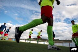 Alma de Africa Union Deportiva's players warm up before a football match against Espera CF in Espera, March 18, 2018.