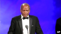 FILE - Sidney Poitier speaks at the 2016 Carousel Of Hope Ball in Beverly Hills, Calif., Oct. 8, 2016.