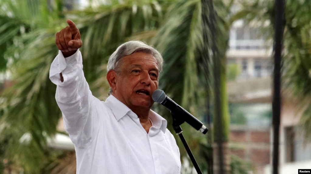 FILE - Mexico's President-elect Andres Manuel Lopez Obrador speaks during a rally as part of a tour to thank supporters for his victory in the July 1 election, in Acapulco, Oct. 3, 2018.