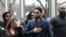 Empire actor Jussie Smollett, center, arrives at the Leighton Criminal Court Building for his hearing on March 14, 2019, in Chicago. 