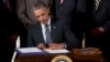 Obama Signs 2 Trade Bills Into Law