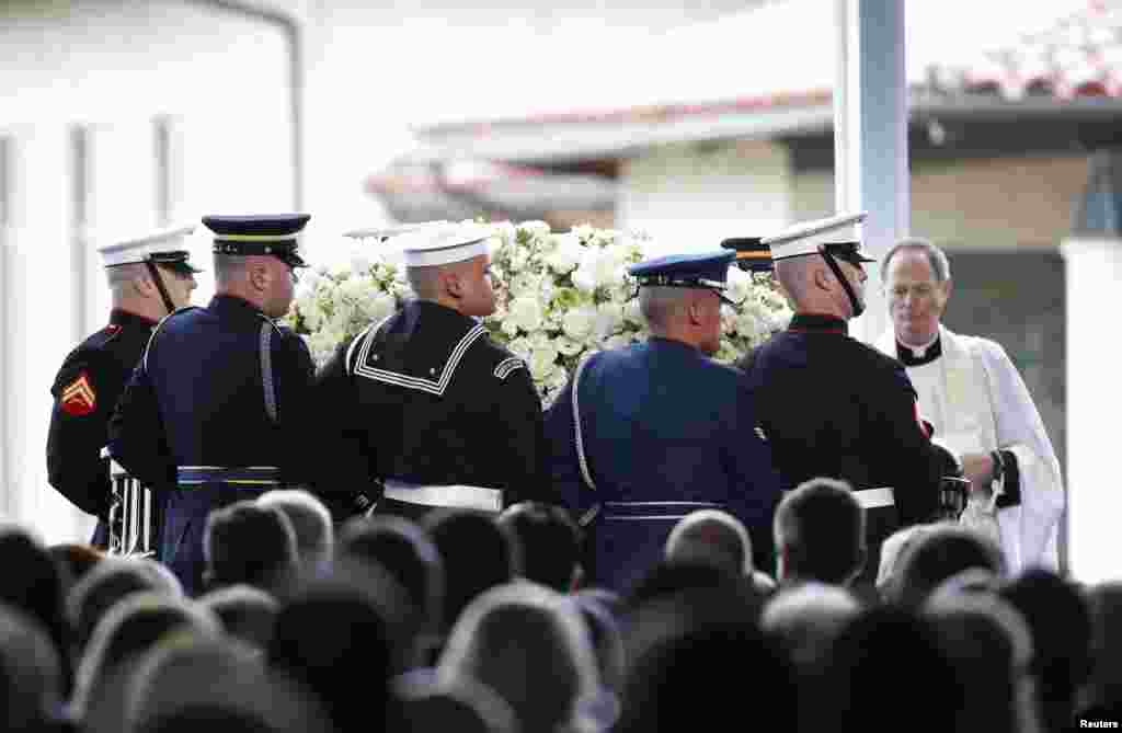 A military honor guard arrives carrying the coffin during the funeral of Nancy Reagan at the Ronald Reagan Presidential Library in Simi Valley, California. The former U.S. first lady died Sunday at age 94, 12 years after her beloved husband.