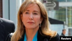 Actor Felicity Huffman, facing charges in a nationwide college admissions cheating scheme, enters federal court in Boston, Massachusetts, April 3, 2019.