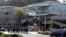 Law enforcement officials walk toward YouTube offices in San Bruno, Calif., April 3, 2018. 