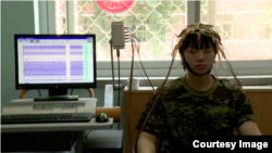 A Chinese teen receives treatment at an Internet addiction camp in a still from the new documentary "Web Junkie."