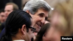 John Kerry, the new U.S. Secretary of State, greets employees of the State Department in Washington February 4, 2013. Today is Kerry's first official day at the State Department. REUTERS/Gary Cameron (UNITED STATES - Tags: POLITICS) - RTR3DCG7