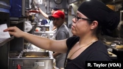 Staff at immigrant-owned restaurant Taquería Mi Pueblo prepare food in Detroit’s Mexicantown.