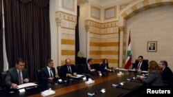 Lebanese Prime Minister Hassan Diab and officials meet with a team of IMF experts at the government palace in Beirut, Feb. 20, 2020. 