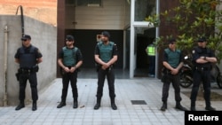 FILE - Spanish police officers.