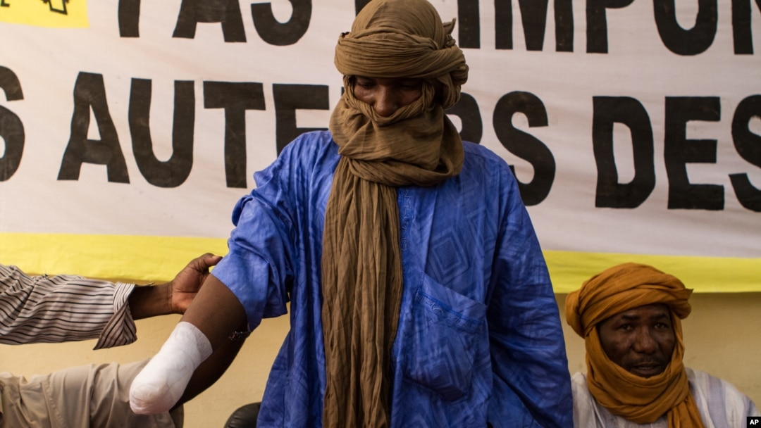 Alhader Ag Almahmoud, a 30-year-old Tuareg herder whose right hand was amputated last month by an Islamist group, displays his bandaged arm at an Amnesty International press conference in Bamako, Mali, September 20, 2012.
