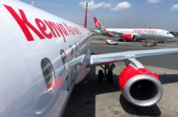 FILE - Kenya Airways planes are seen parked at the Jomo Kenyatta International Airport near Nairobi, Nov. 6, 2019.