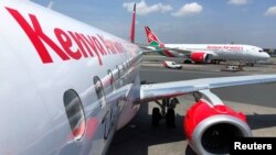 FILE - Kenya Airways planes are seen parked at the Jomo Kenyatta International Airport near Nairobi, Nov. 6, 2019. 