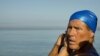 Swimmer Diana Nyad adjusts her swimming cap before her swim to Florida from Havana, Cuba, Aug. 31, 2013. 