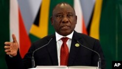 South African President Cyril Ramaphosa addresses a media conference at the end of the BRICS Summit in Johannesburg, South Africa, Friday, July 27, 2018.