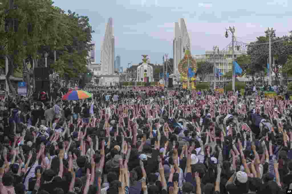 Pro-democracy students raise three-fingers, symbol of resistance salute, during a rally in Bangkok, Thailand.&nbsp;Protesters have stepped up pressure on the government to meet their demands - to hold new elections, to amend the constitution, and an end to intimidation of critics.